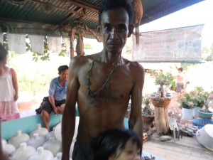 A Sukhothai local sporting amulets and tattoos