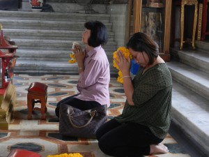 Honoring Bangkok's City Pillar.