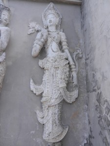 Devata on the ho trai of Wat Phra Singh, Chiang Mai, Thailand.