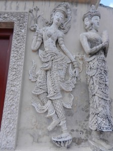 Devatas on the ho trai of Wat Phra Singh, Chiang Mai, Thailand.