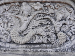 Stucco figures on the ho trai of Wat Phra Singh, Chiang Mai, Thailand.