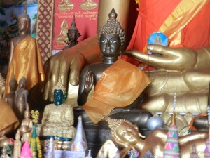 Statues on the altar of Wat Monorom, Luang Prabang, Laos.