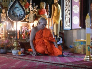 A late afternoon service in Wat Mahathat, Luang Prabang, Laos.