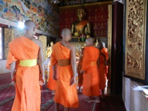 Monks in Wat Mahathat, Luang Prabang, Laos.
